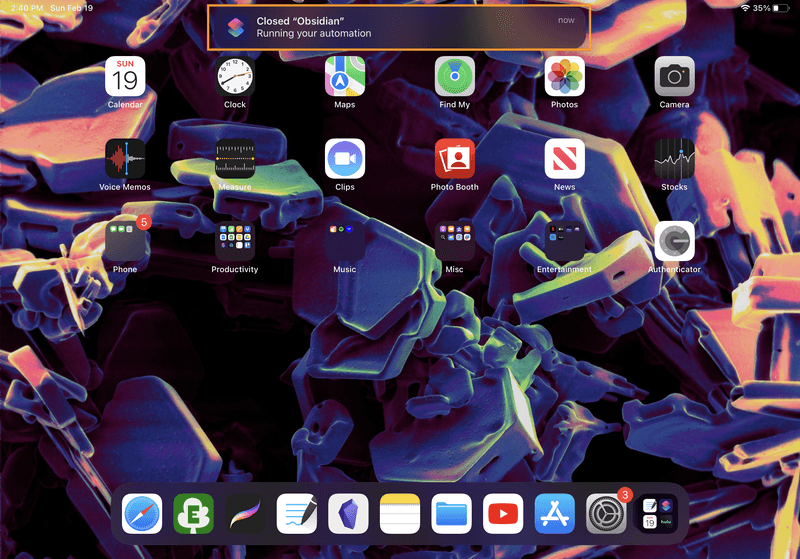 iPad screenshot of the home screen, with a notification at the top of the screen that says, "Closed 'Obsidian'. Running your automation."