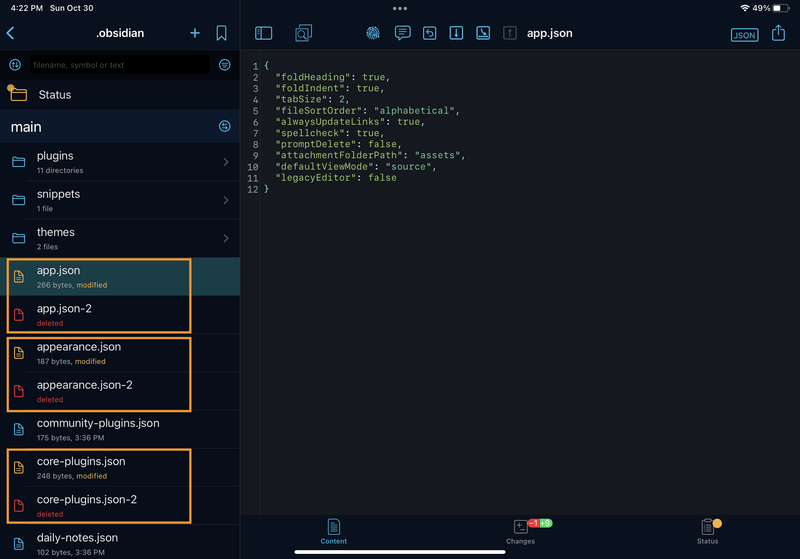 iPad screenshot of Working Copy. In the ".obsidian" directory, there are duplicate files highlighted: "app.json" and "app.json-2", "appearance.json" and "appearance.json-2", "core-plugins.json" and "core-plugins.json-2". All the "-2" files are marked as "deleted".