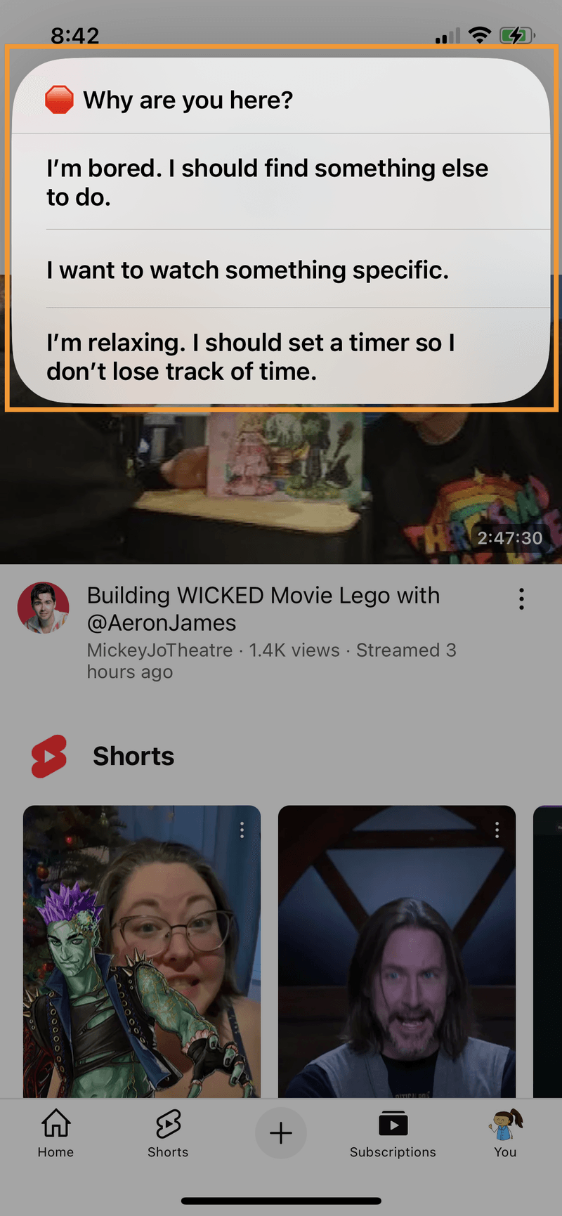 iPhone screenshot of the "Why are you here?" menu showing on top of the YouTube app